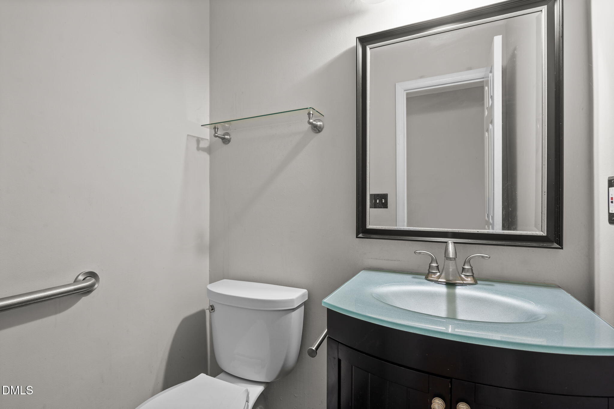 4700 Tolley Court Raleigh, NC 27616 - Photo 24 of 37 a bathroom with a sink and a toilet