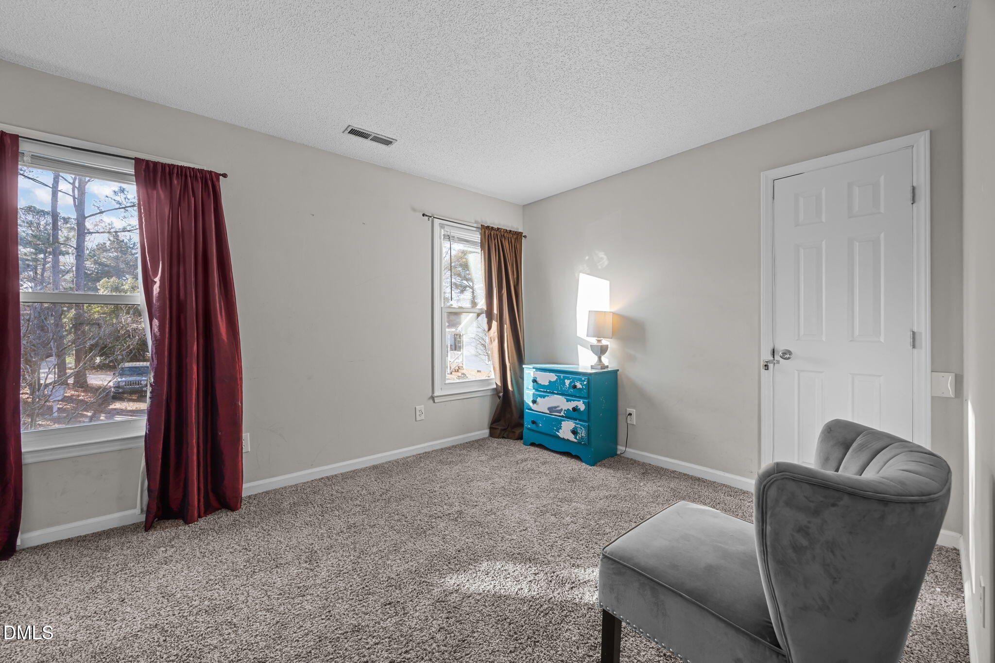 4700 Tolley Court Raleigh, NC 27616 - Photo 25 of 37 a living room with furniture and a window