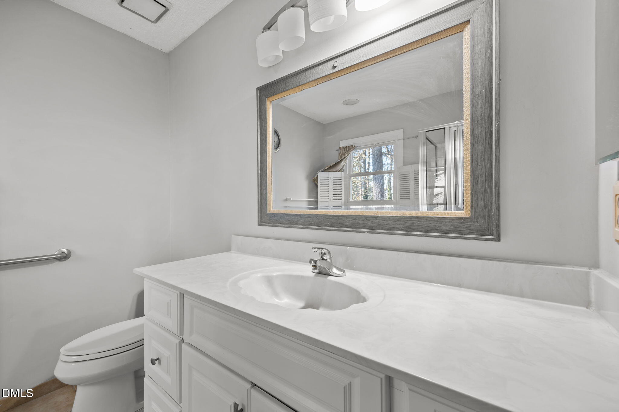 4700 Tolley Court Raleigh, NC 27616 - Photo 31 of 37 a bathroom with a sink and a toilet
