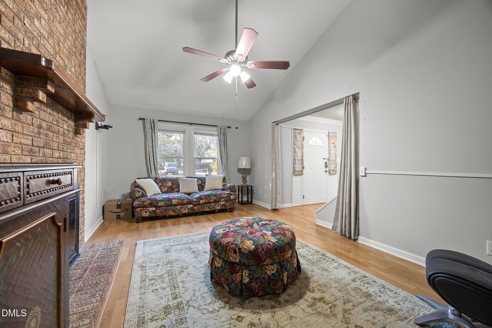 4700 Tolley Court Raleigh, NC 27616 - Photo 8 of 37 a living room with furniture and a fireplace