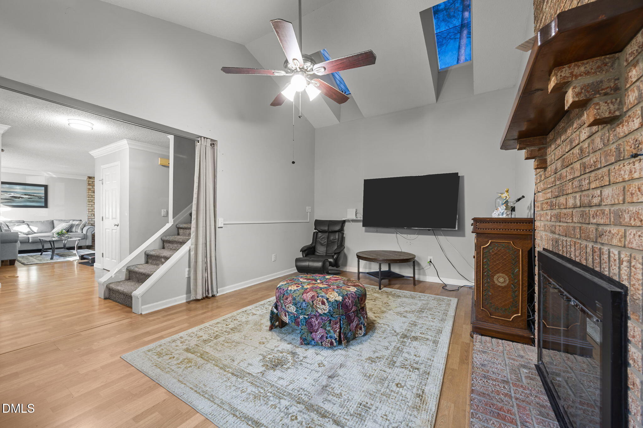 4700 Tolley Court Raleigh, NC 27616 - Photo 9 of 37 a living room with furniture and a flat screen tv