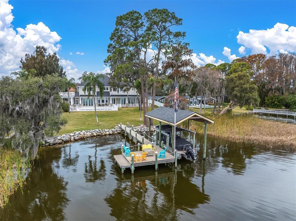 4650 Ridgeview Road Palm Harbor, FL 34684 - Photo 2 of 100 a view of a lake with houses