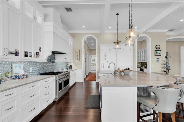 a work room with furniture a rug and a window