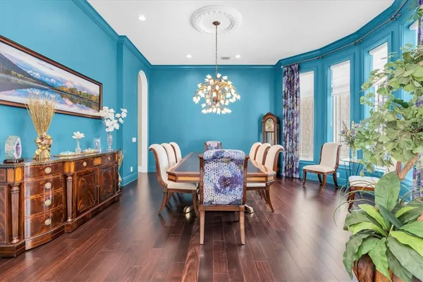 a bathroom with a bathtub shower sink and mirror