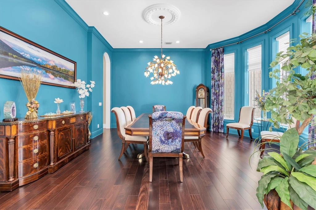 4650 Ridgeview Road Palm Harbor, FL 34684 - Photo 24 of 100 a dining room with furniture a chandelier and wooden floor