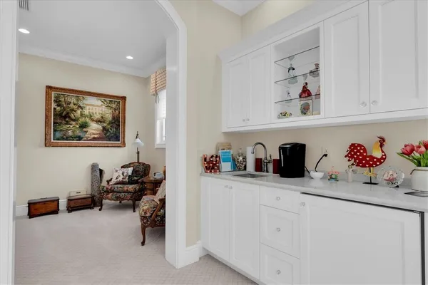 a view of a patio with a table chairs and a fire pit