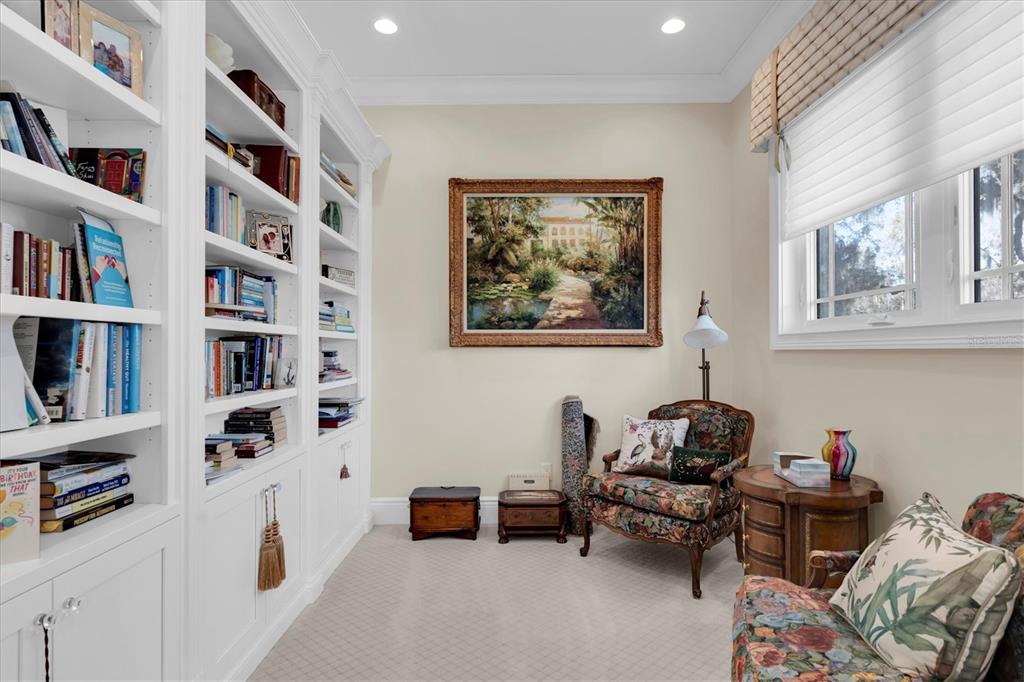 4650 Ridgeview Road Palm Harbor, FL 34684 - Photo 44 of 100 a bedroom with furniture and a book shelf