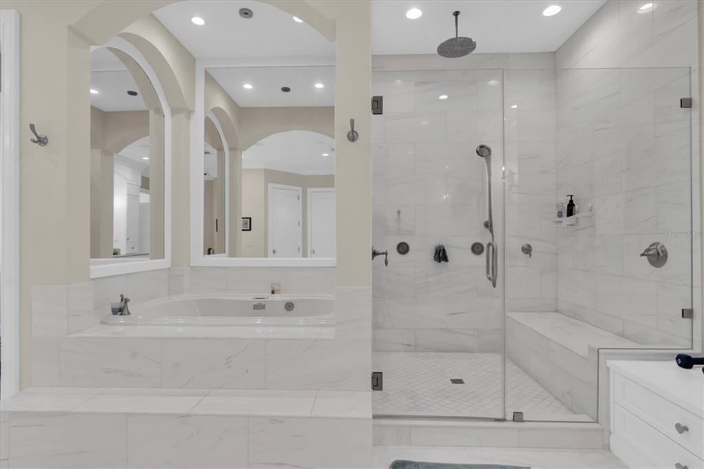 4650 Ridgeview Road Palm Harbor, FL 34684 - Photo 47 of 100 a bathroom with a bathtub shower sink and mirror