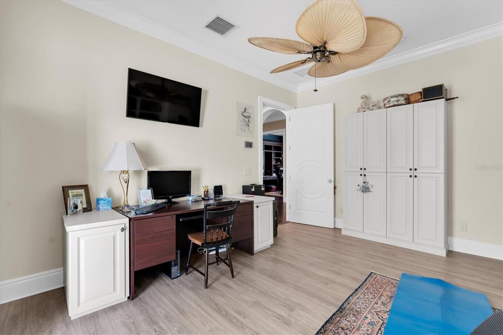 4650 Ridgeview Road Palm Harbor, FL 34684 - Photo 56 of 100 a view of a workspace with furniture and a flat screen tv