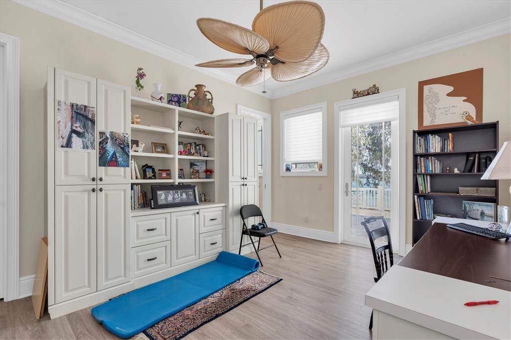 4650 Ridgeview Road Palm Harbor, FL 34684 - Photo 57 of 100 a view of a workspace with furniture and wooden floor