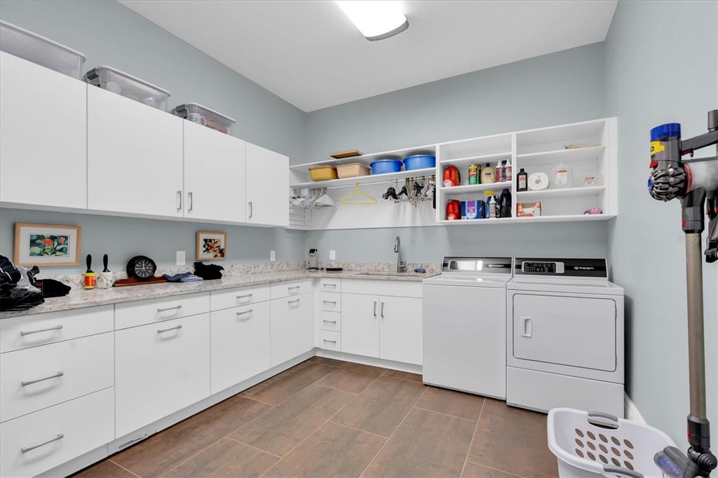 4650 Ridgeview Road Palm Harbor, FL 34684 - Photo 67 of 100 a kitchen with cabinets a sink and wooden floor