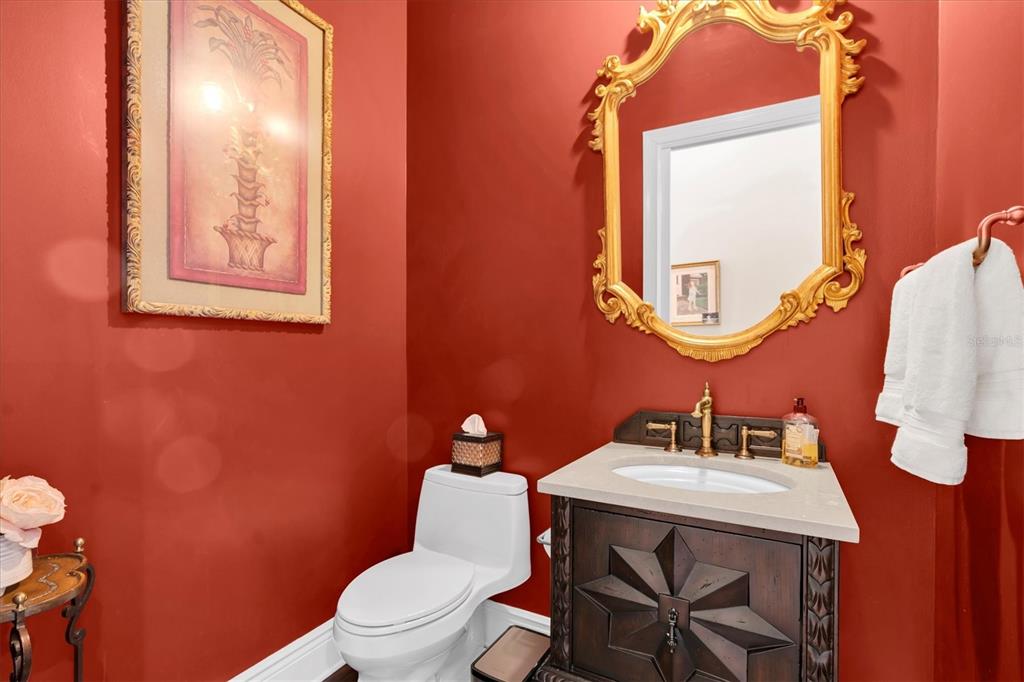 4650 Ridgeview Road Palm Harbor, FL 34684 - Photo 69 of 100 a bathroom with a toilet a sink and mirror