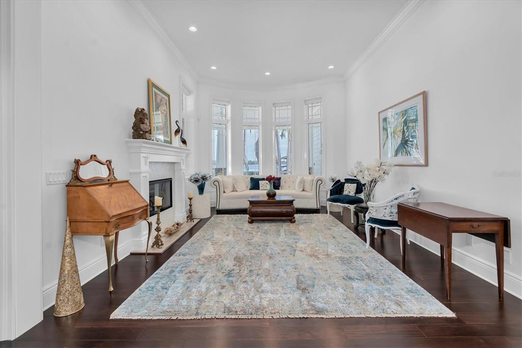 4650 Ridgeview Road Palm Harbor, FL 34684 - Photo 7 of 100 a living room with furniture and a fireplace