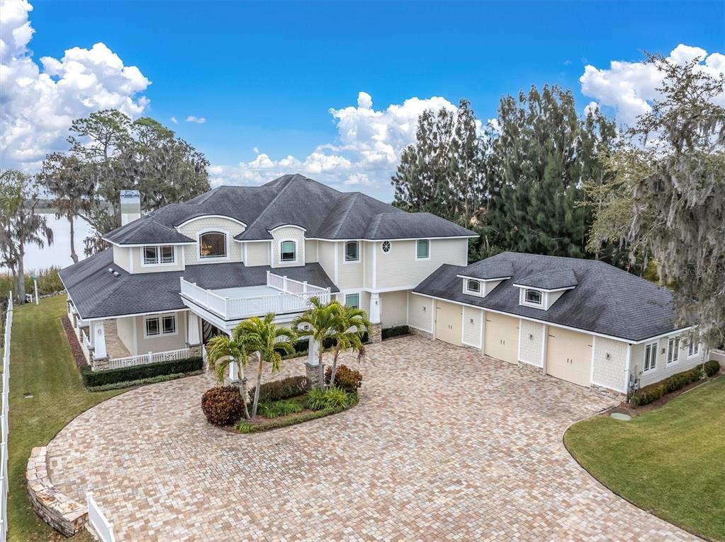 4650 Ridgeview Road Palm Harbor, FL 34684 - Photo 71 of 100 a view of a house with a yard and sitting area