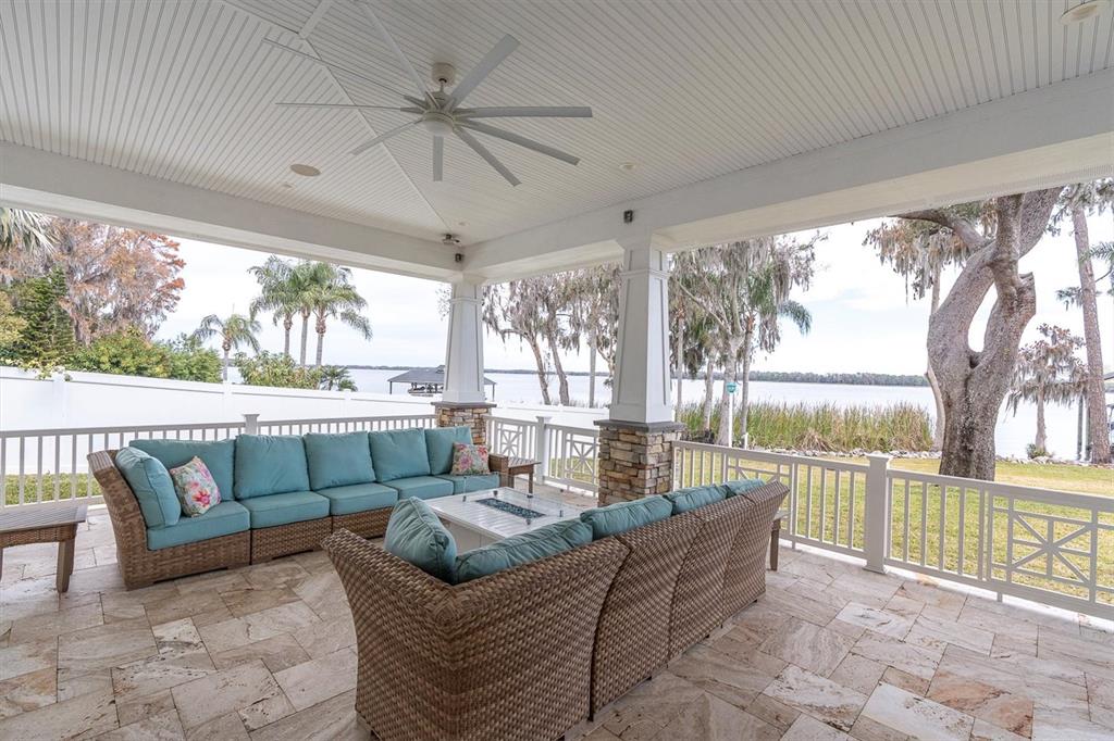 4650 Ridgeview Road Palm Harbor, FL 34684 - Photo 97 of 100 a living room with furniture and a floor to ceiling window