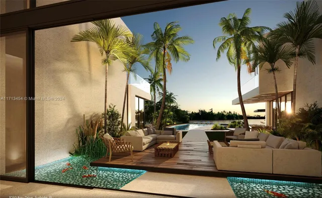 a view of a patio with couches and a potted plant on a table