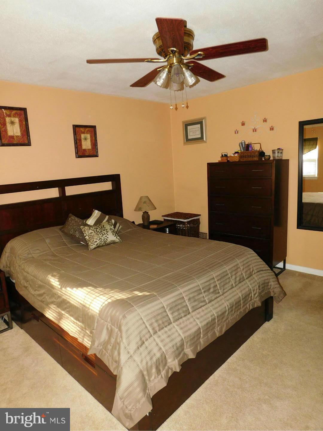 7708 Charlesmont Road Baltimore, MD 21222 - Photo 12 of 28 a bed sitting in a bedroom with a bed