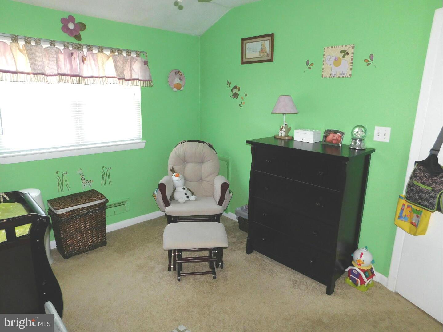 7708 Charlesmont Road Baltimore, MD 21222 - Photo 16 of 28 a living room with furniture and a window