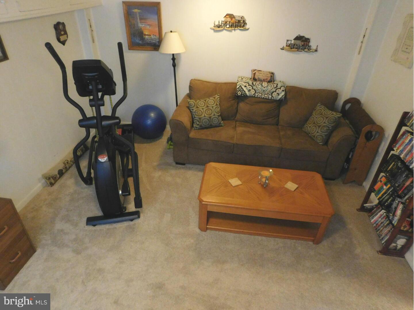 7708 Charlesmont Road Baltimore, MD 21222 - Photo 20 of 28 a living room with furniture and a window
