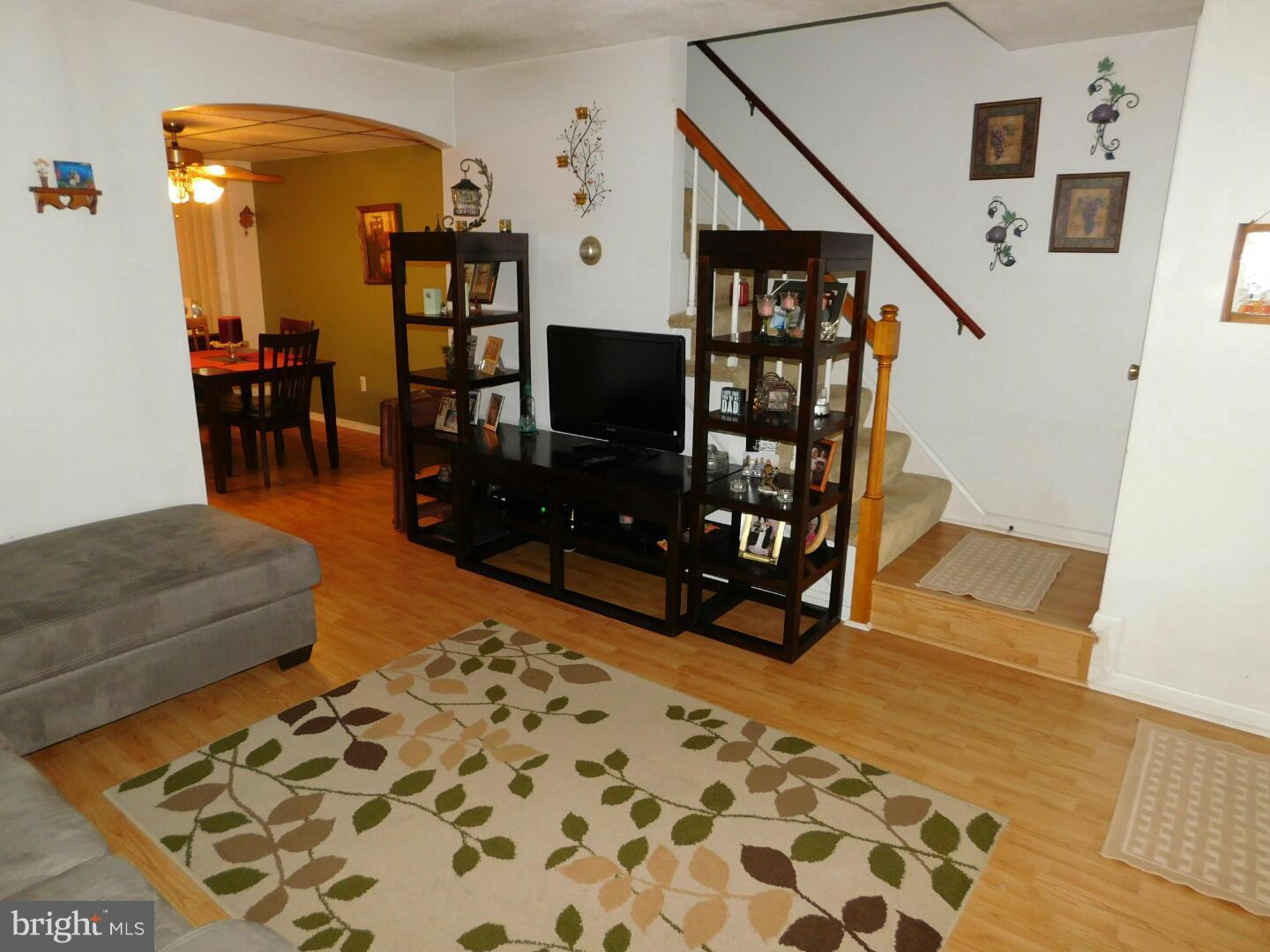 7708 Charlesmont Road Baltimore, MD 21222 - Photo 3 of 28 a living room with furniture and wooden floor