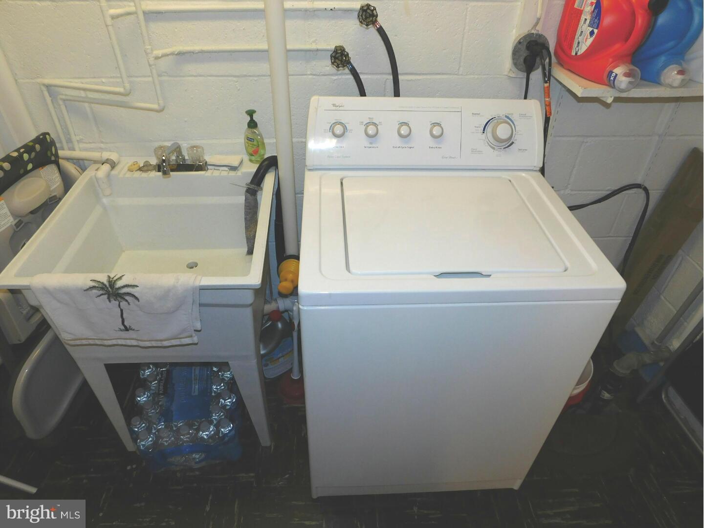 7708 Charlesmont Road Baltimore, MD 21222 - Photo 25 of 28 a utility room with dryer and washer