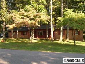 a house with a tree in front of it
