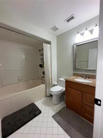 a bathroom with a sink a toilet and a bathtub