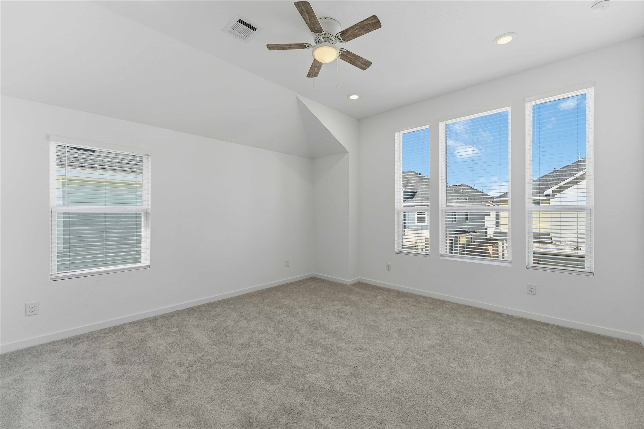 2206 Via Isa Lane Houston, TX 77051 - Photo 15 of 30 an empty room with chandelier fan and windows