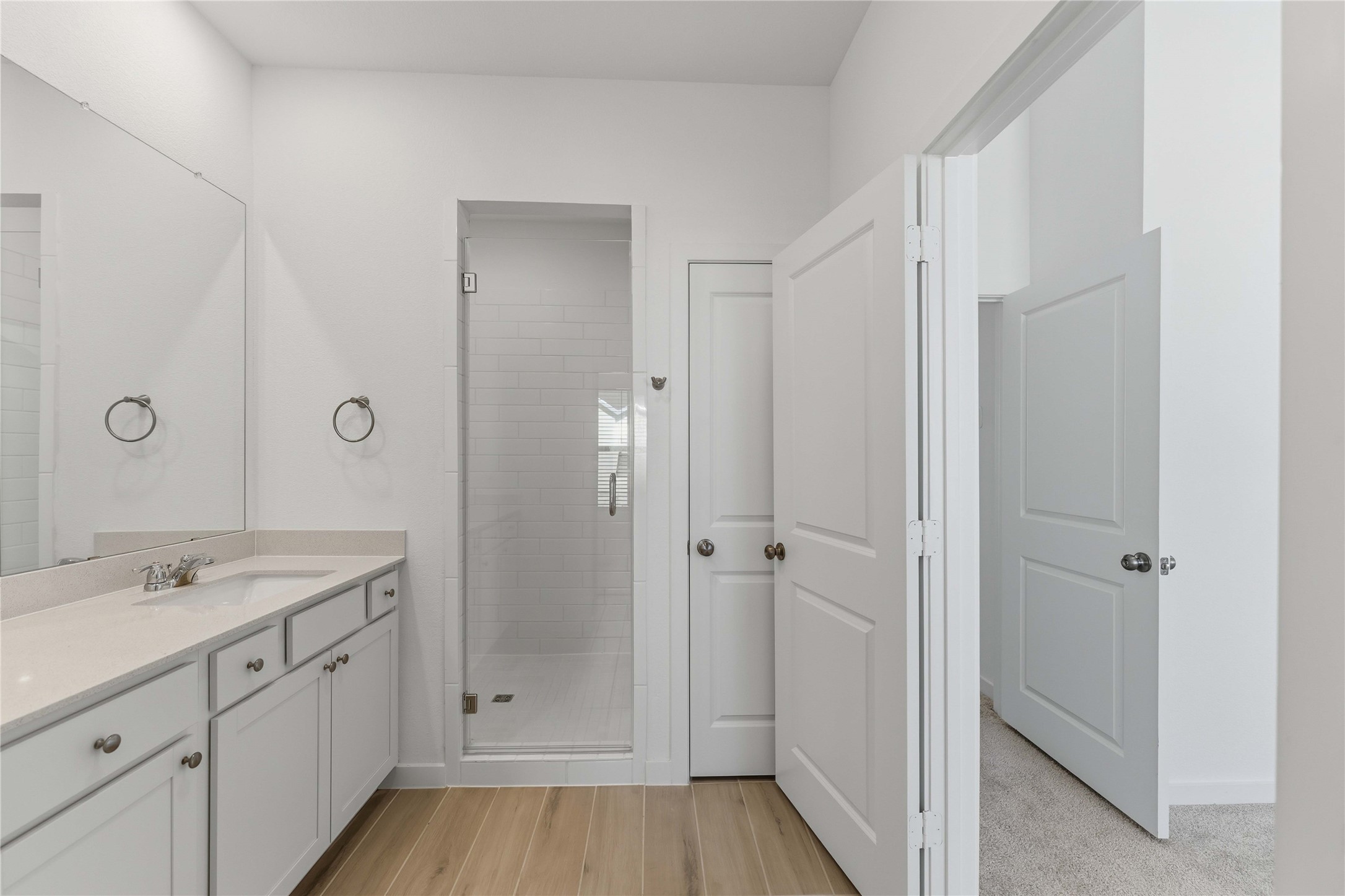 2206 Via Isa Lane Houston, TX 77051 - Photo 17 of 30 a spacious bathroom with a shower sink and mirror