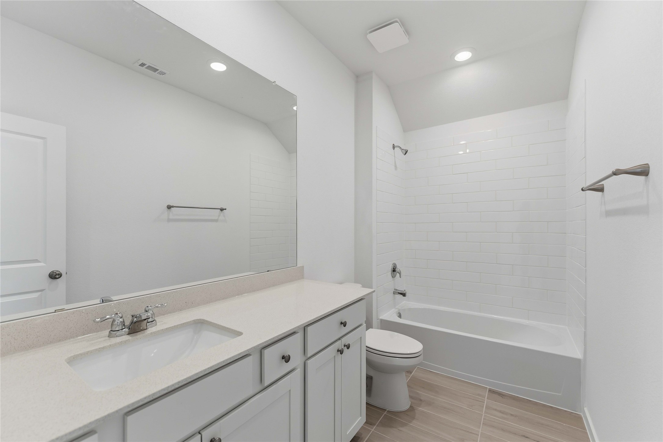 2206 Via Isa Lane Houston, TX 77051 - Photo 22 of 30 a bathroom with a granite countertop toilet a sink and a bathtub