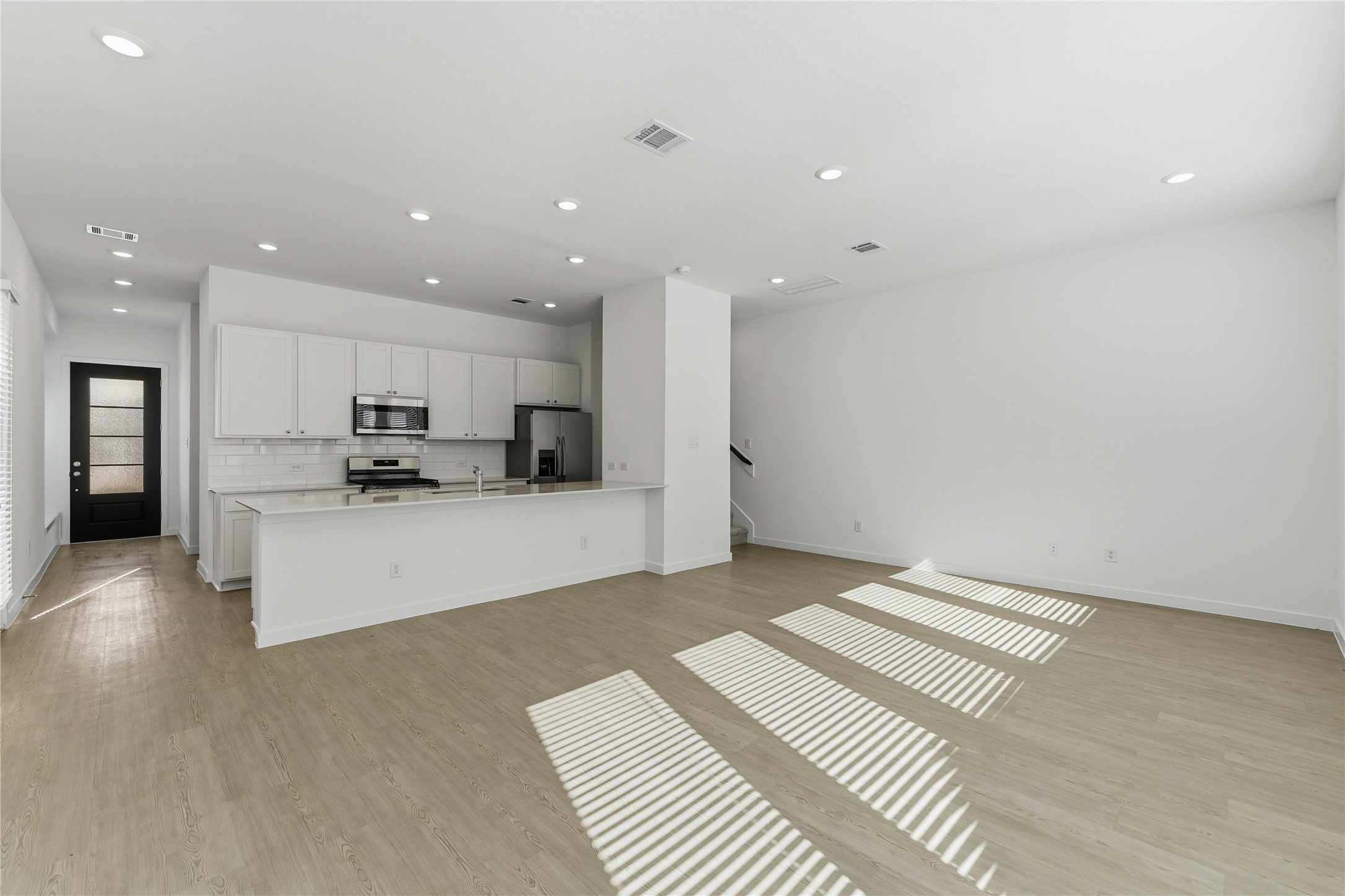2206 Via Isa Lane Houston, TX 77051 - Photo 5 of 30 a living room with stainless steel appliances kitchen island granite countertop a refrigerator and a sink