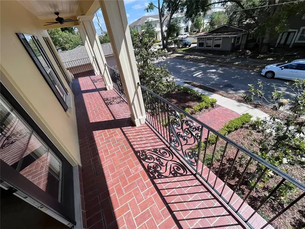 a view of a small house with a yard