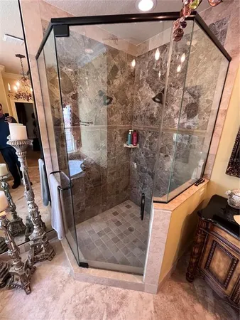 a bathroom with a shower and a sink