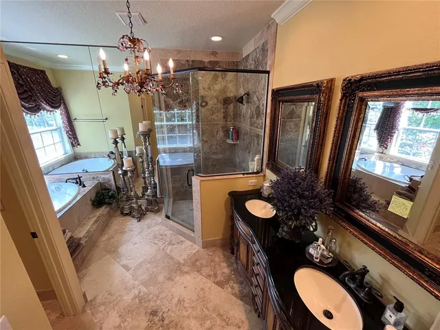 a dining room with furniture and a floor to ceiling window