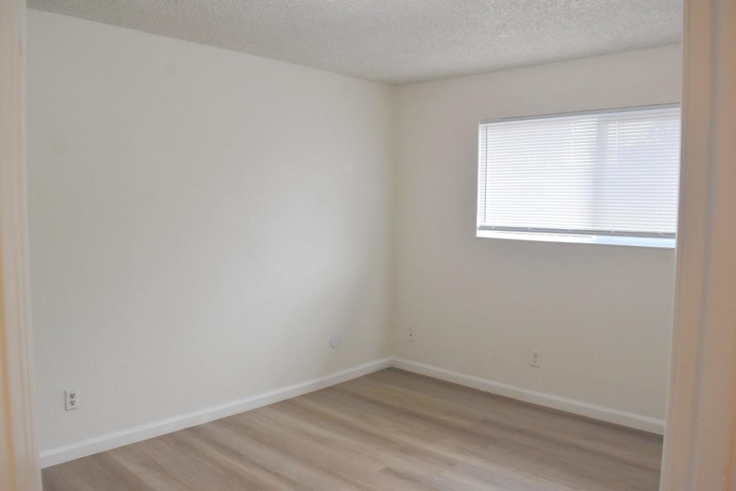722 East Swain Road Stockton, CA 95207 - Photo 12 of 16 an empty room with a window