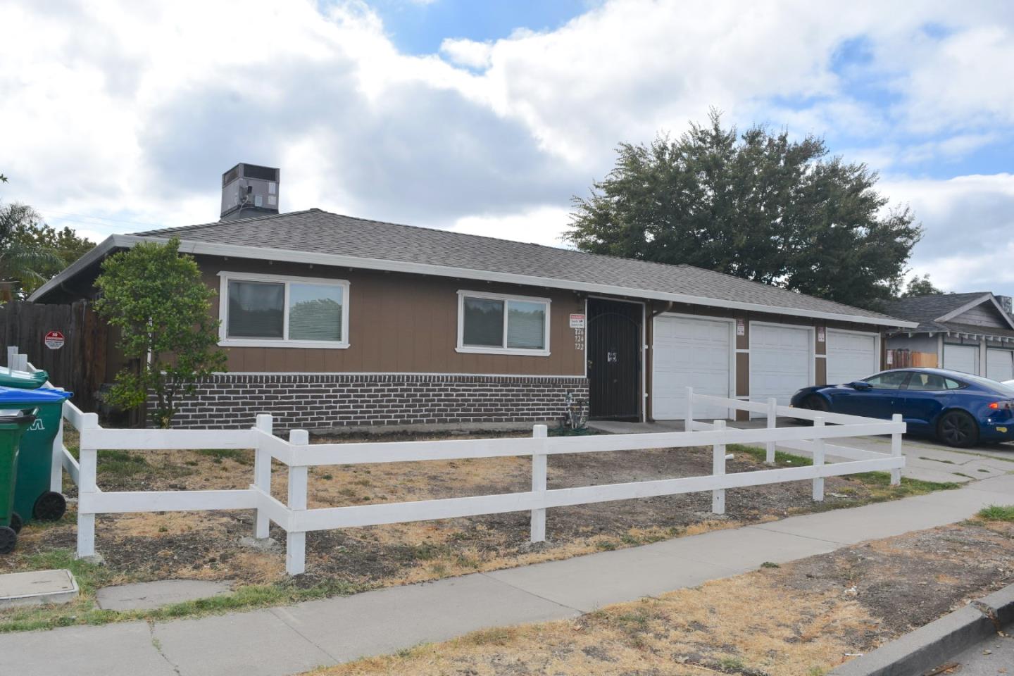 722 East Swain Road Stockton, CA 95207 - Photo 3 of 16 a front view of a house with parking space