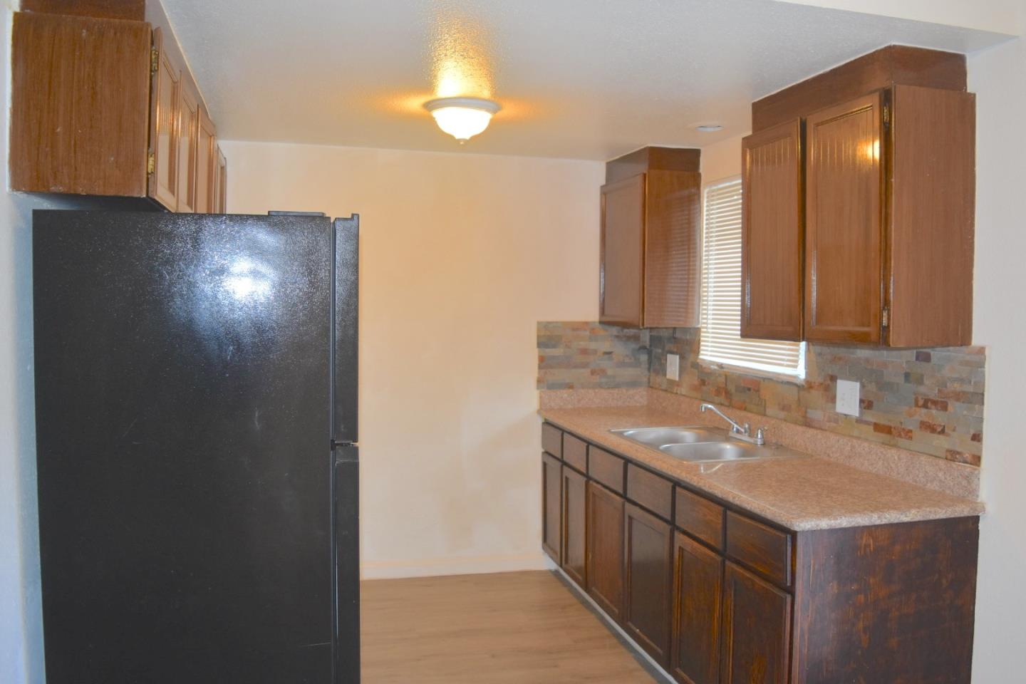 722 East Swain Road Stockton, CA 95207 - Photo 7 of 16 a bathroom with a sink and a mirror