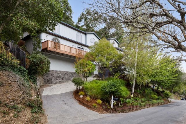 a living room with furniture wooden floor and a fireplace