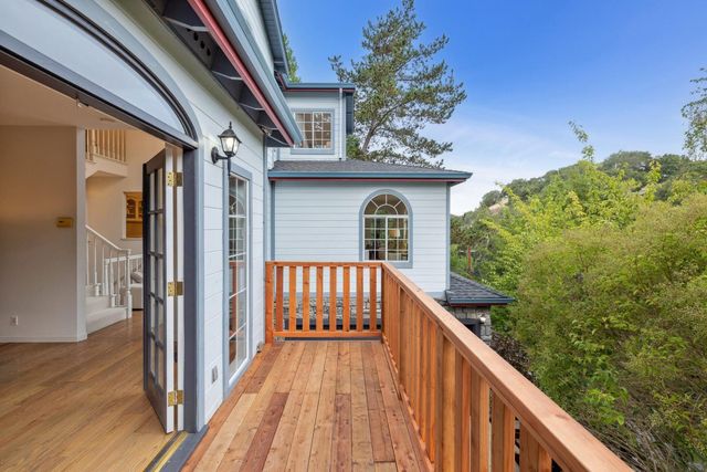 a stove top oven sitting inside of a kitchen