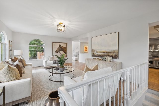 a bedroom with a large bed and a large window