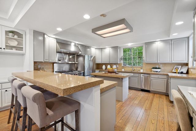 a bedroom with two beds and a window