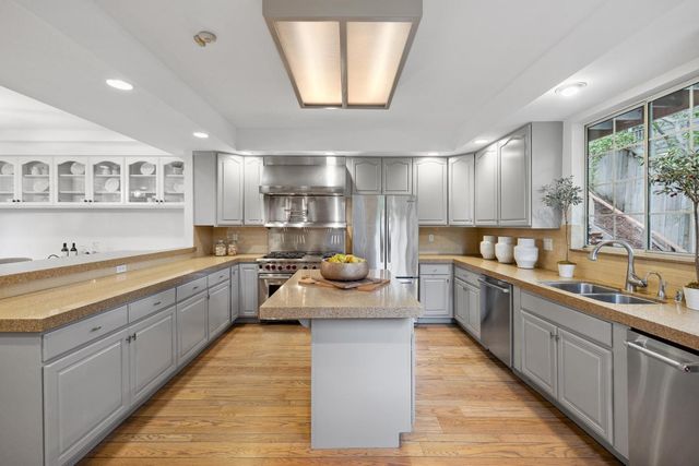 a bedroom with a bed and a lounge chair