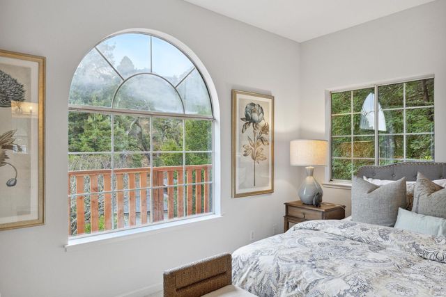 an aerial view of a house with yard and outdoor seating