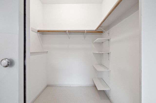 an aerial view of residential house with green space and mountain view