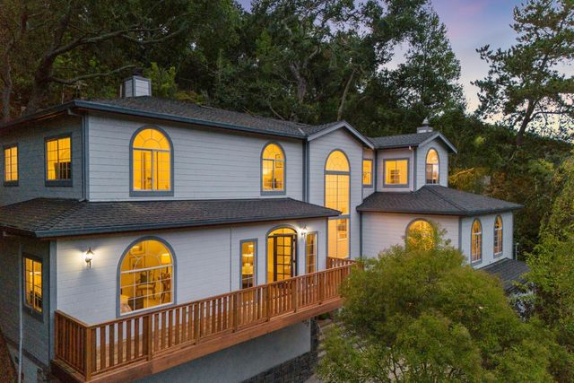 a view of an entryway with wooden floor and door