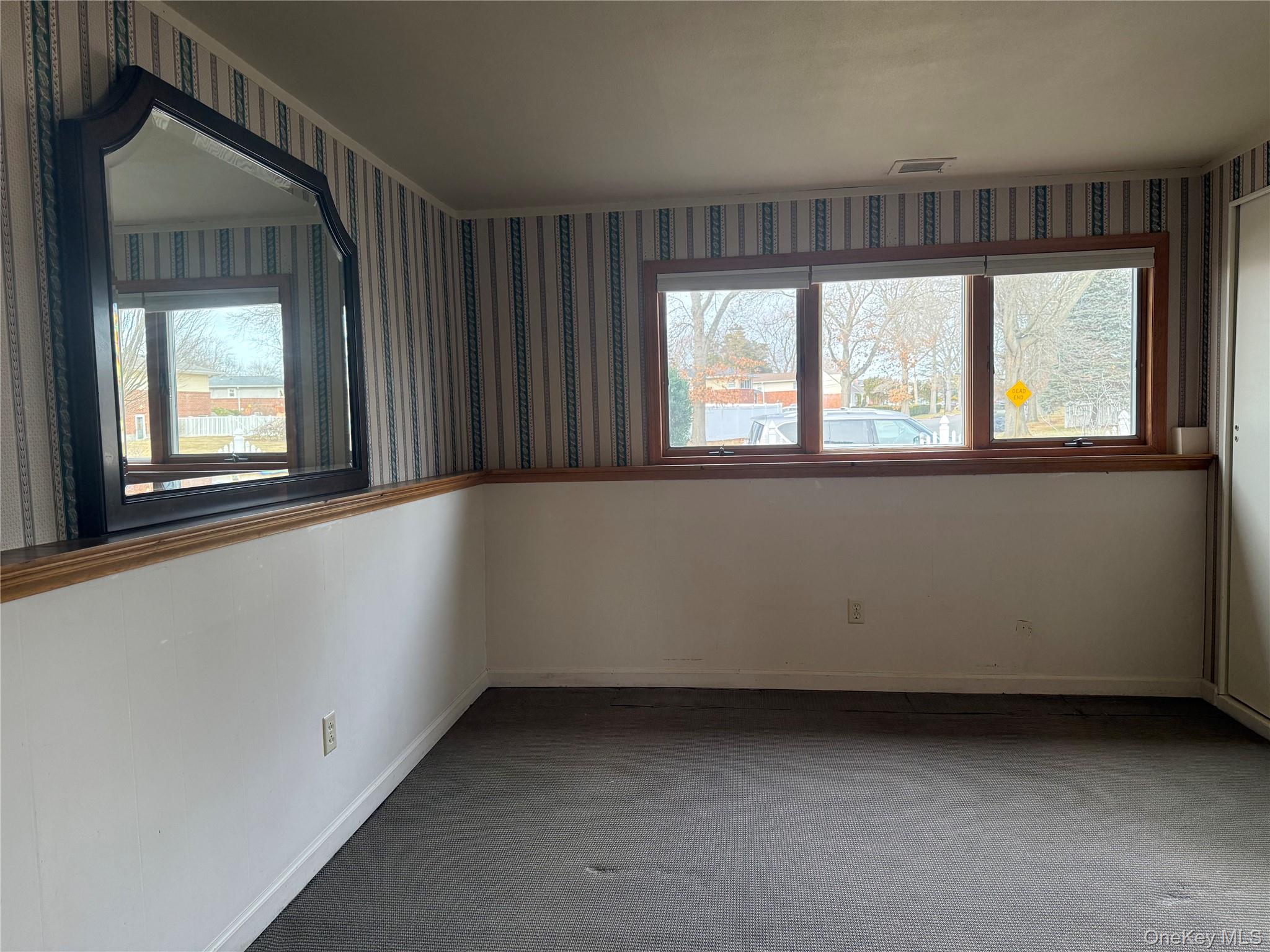 14 Genesee Drive Commack, NY 11725 - Photo 13 of 21 a view of an empty room with a window