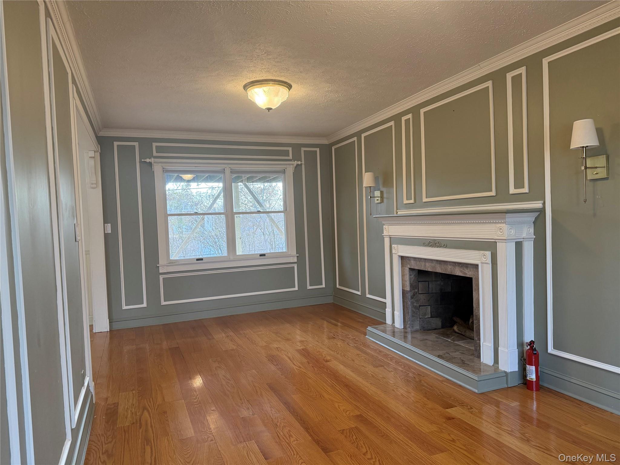 14 Genesee Drive Commack, NY 11725 - Photo 2 of 21 a view of an empty room with wooden floor fireplace and a window
