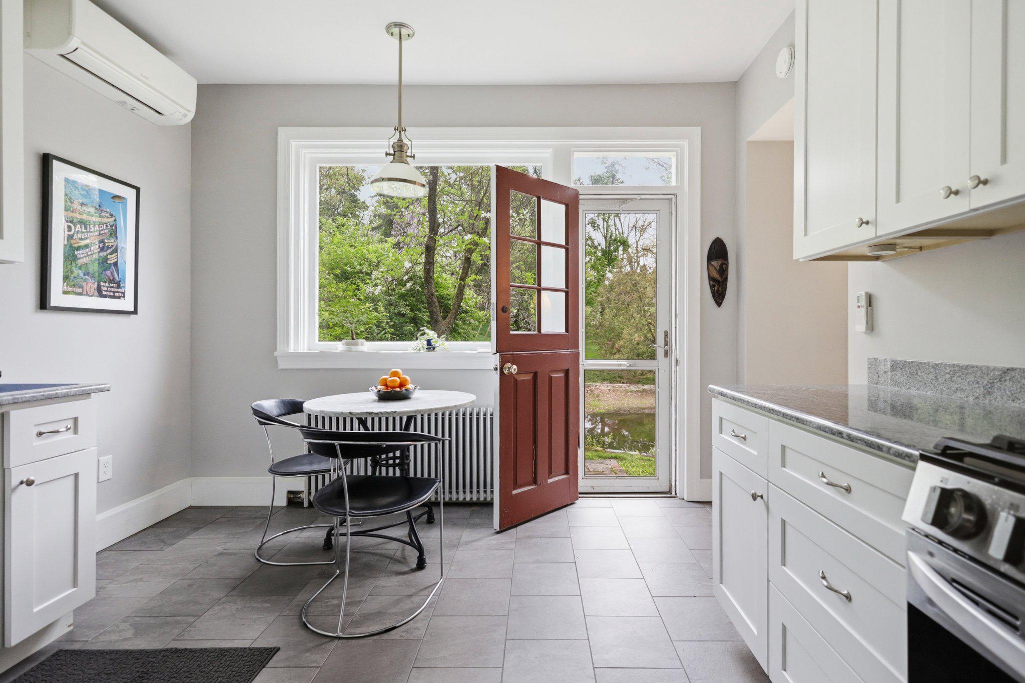 91 East Bells Mill Road Philadelphia, PA 19118 - Photo 14 of 29 Eat-in kitchen w/ dutch door to outdoor space