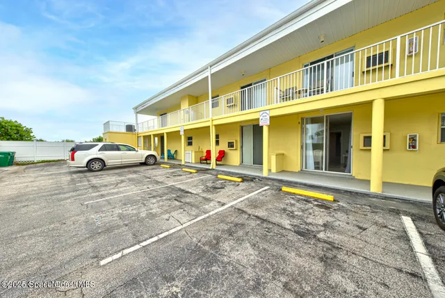 a cars parked in front of a building