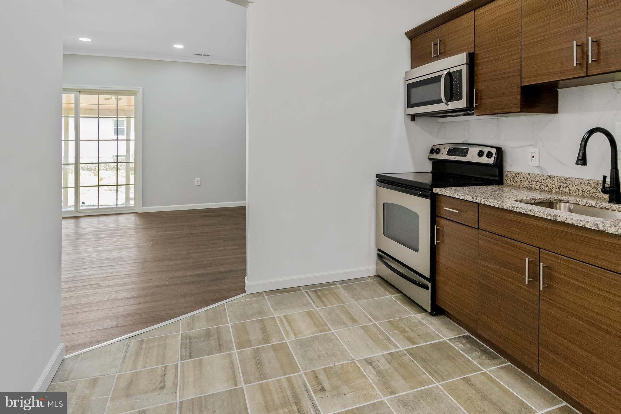 2008 Holly Neck Road Baltimore, MD 21221 - Photo 6 of 23 KITCHEN W/ SS APPLIANCES